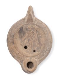 A Roman Discus Lamp Depicting Dionysos Holding a Thyrsos and a Bunch of Grapes