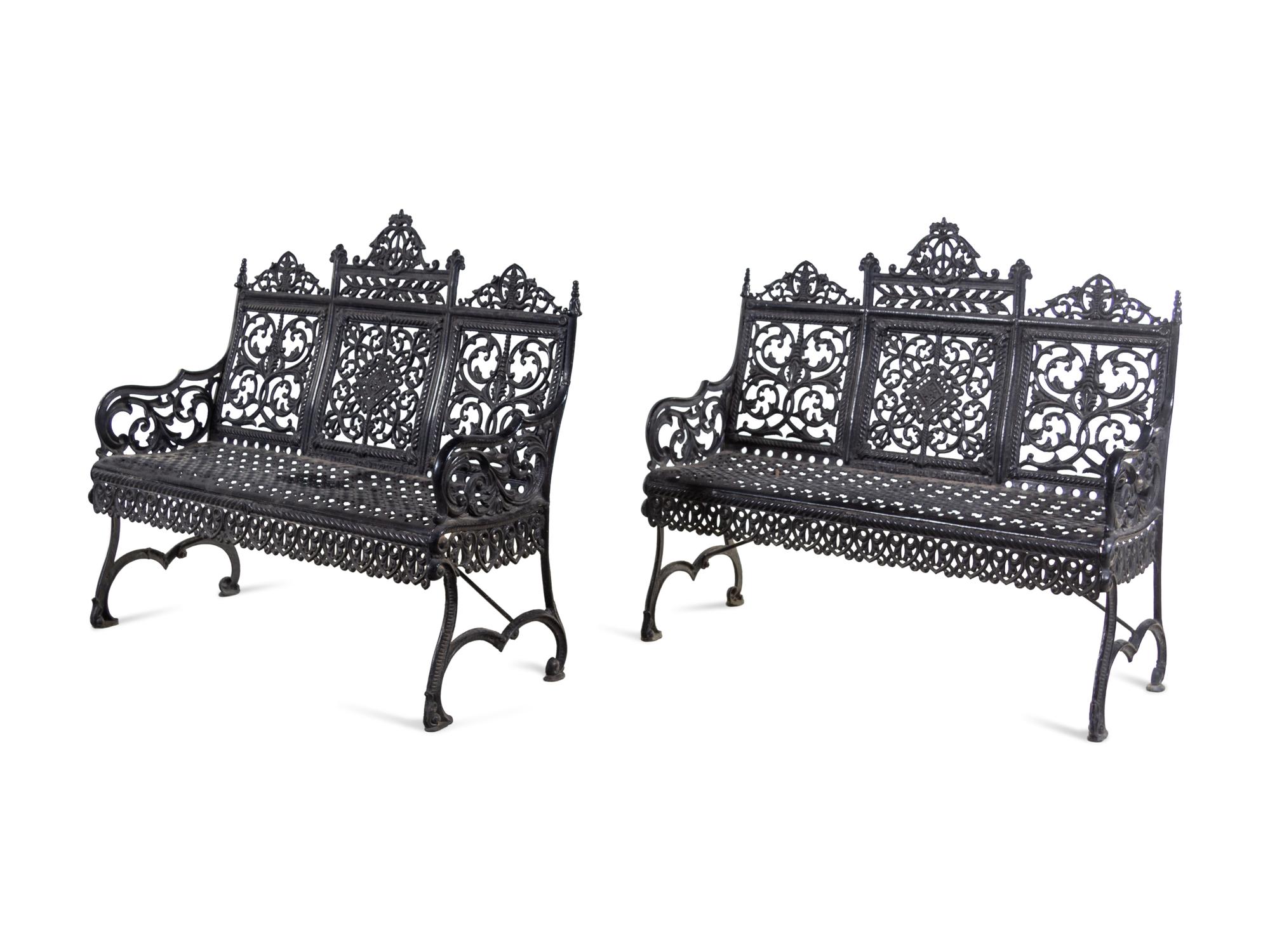 A Pair of American Gothic Revival Painted Cast Iron Garden Benches