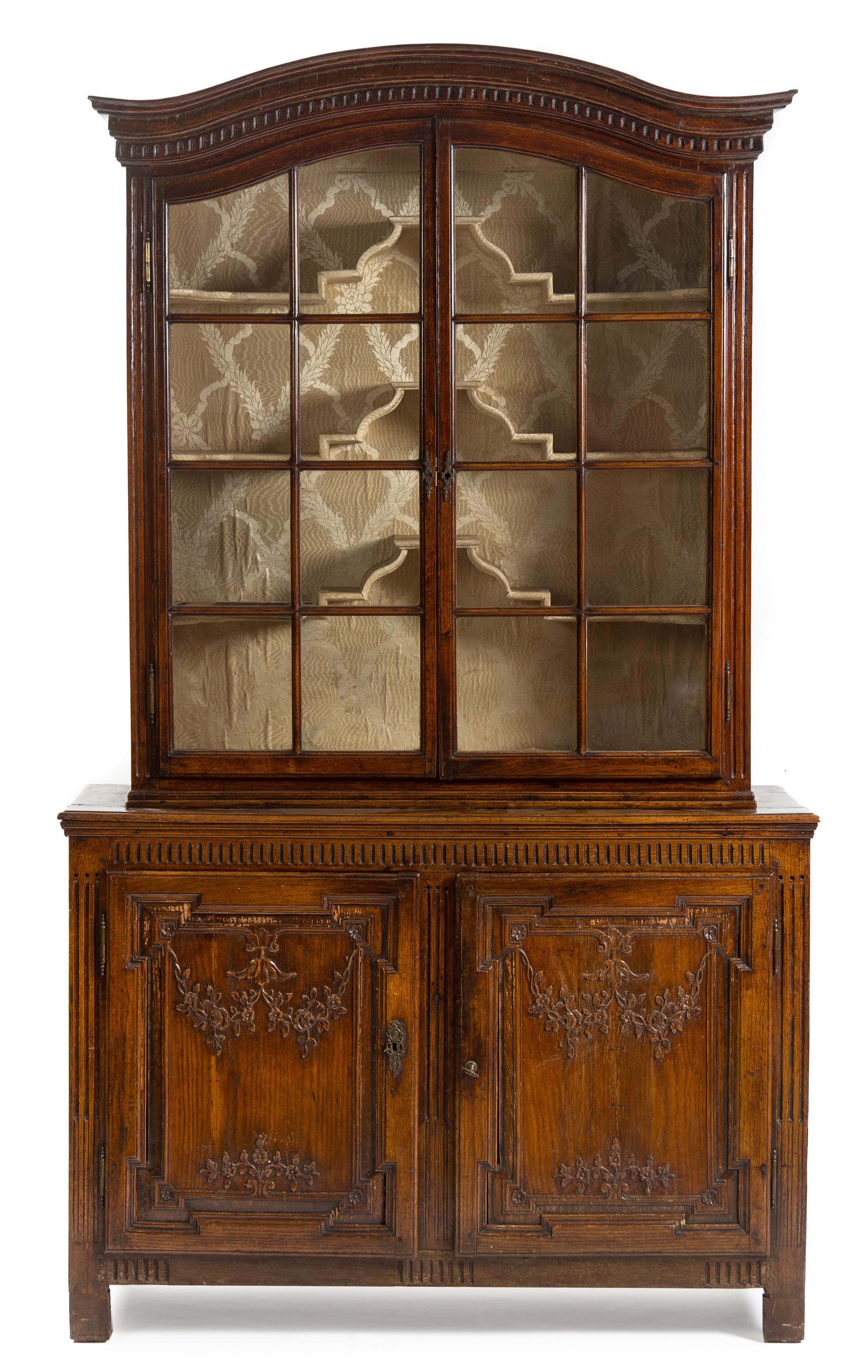 A French Provincial Walnut Bibliotheque Height 91 1/4 x width 54 x depth 17 1/4 inches. — CIRCA 1800