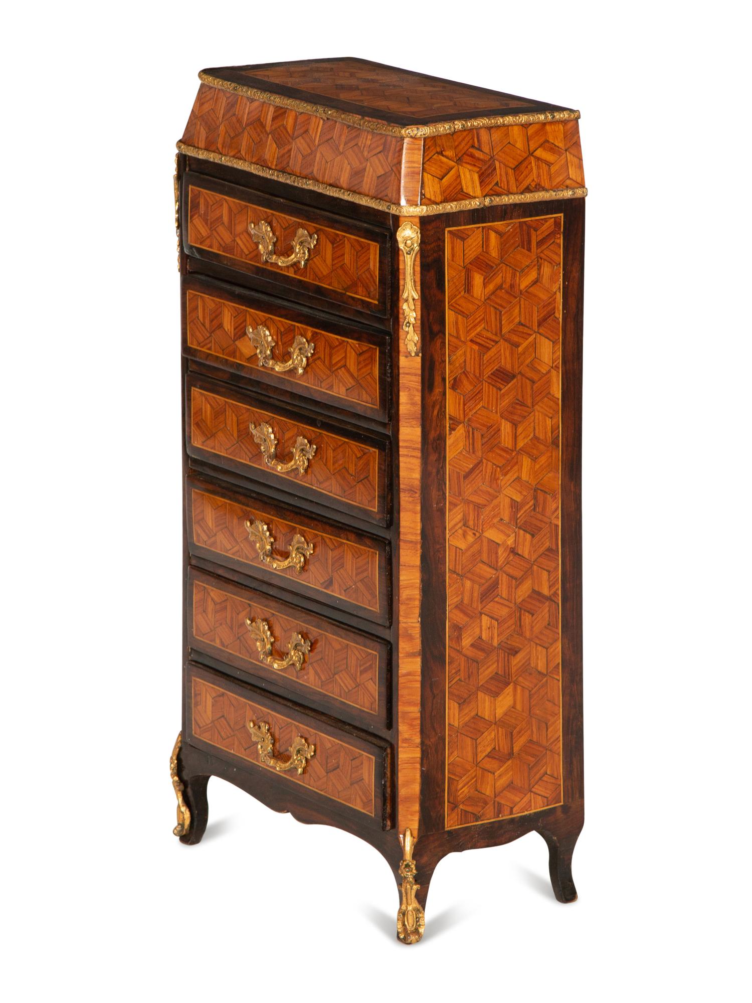 A Diminutive Gilt Bronze Mounted Parquetry Chest of Drawers