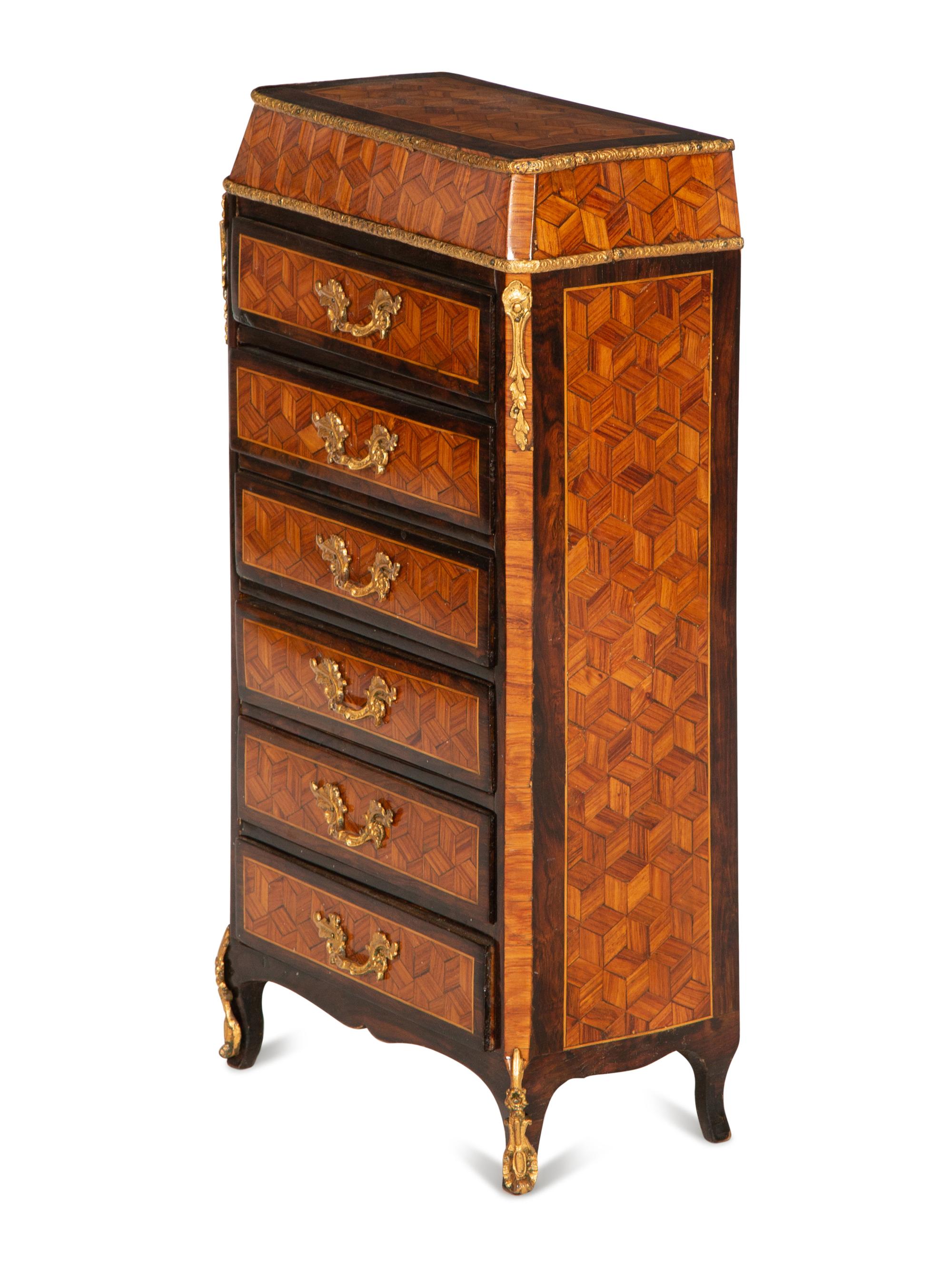 A Diminutive Gilt Bronze Mounted Parquetry Chest of Drawers