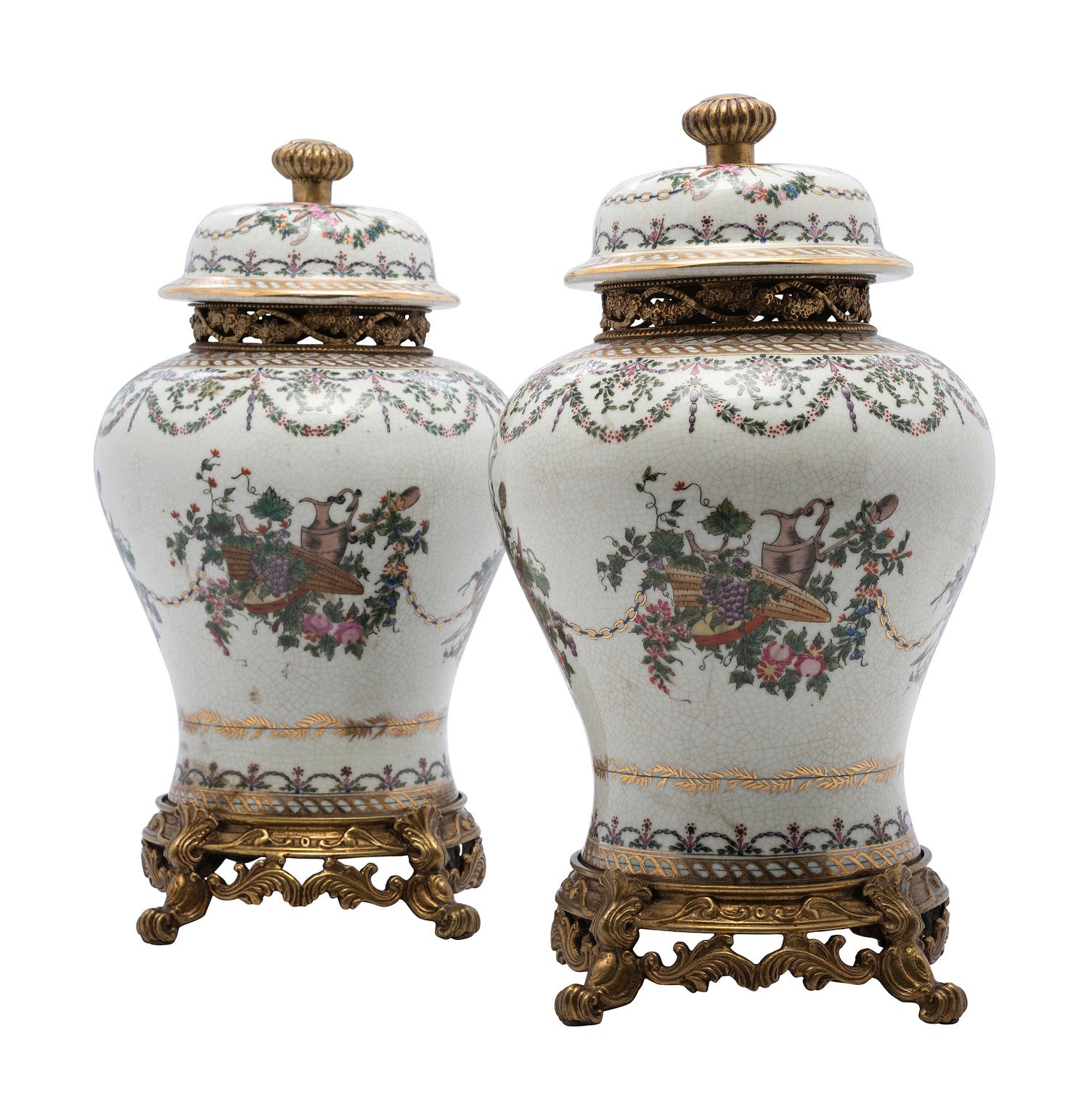 A Pair of United Wilson Gilt Metal Mounted Porcelain Urns
