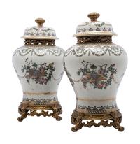 A Pair of United Wilson Gilt Metal Mounted Porcelain Urns