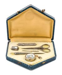 An Art Deco Silvered Metal Sewing Kit, , fitted with a needle case, bodkin, thimble, scissors, stiletto and tape measure.