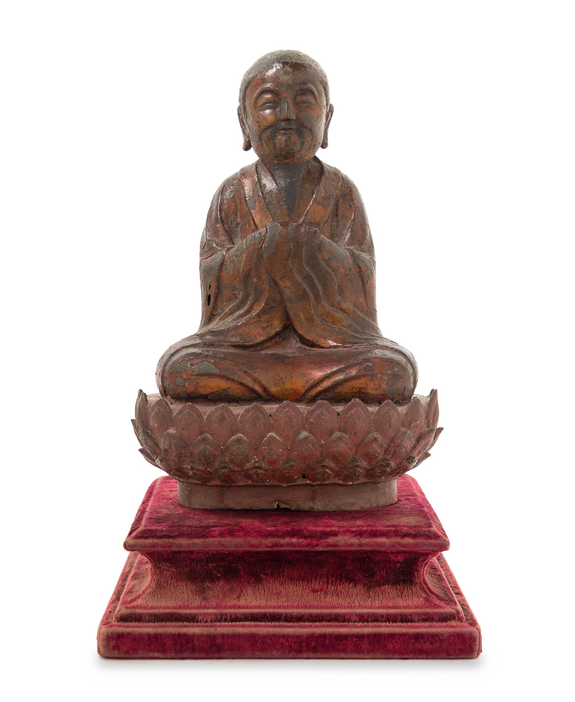 A Chinese Gilt Lacquered Bronze Figure of a Monk MING DYNASTY Height 12 x width 8 inches. — MING DYNASTY