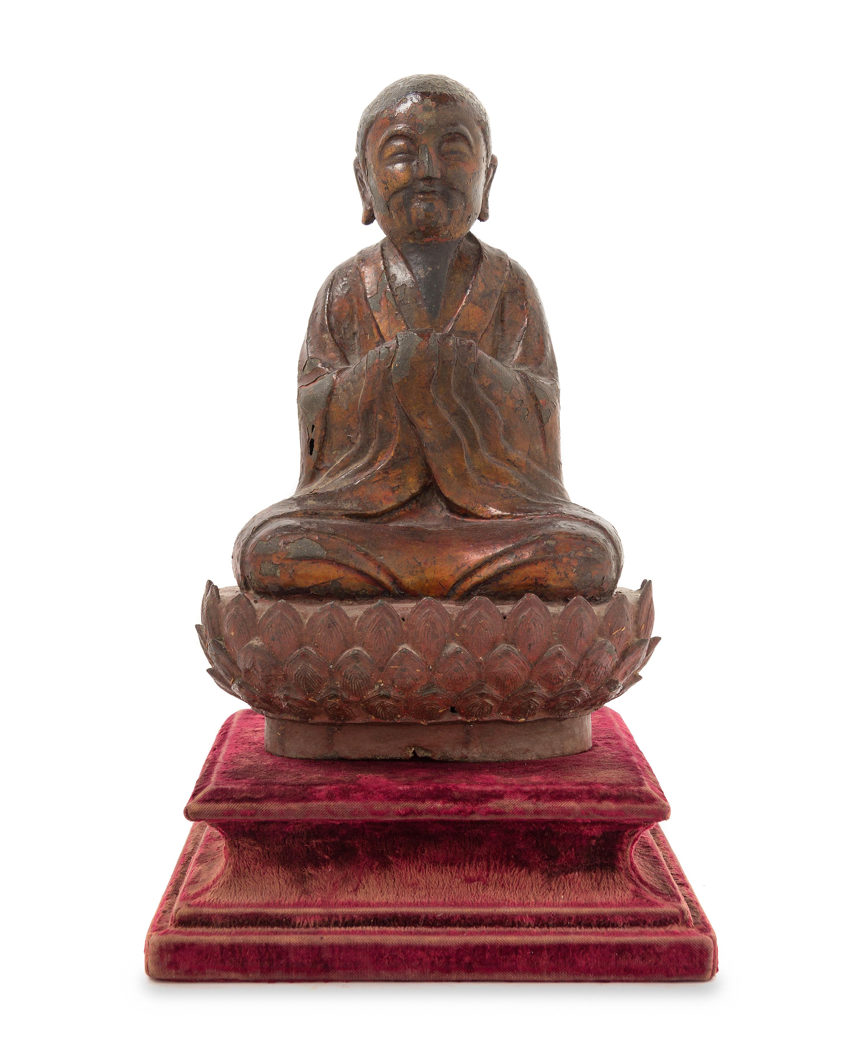 A Chinese Gilt Lacquered Bronze Figure of a Monk MING DYNASTY Height 12 x width 8 inches. — MING DYNASTY