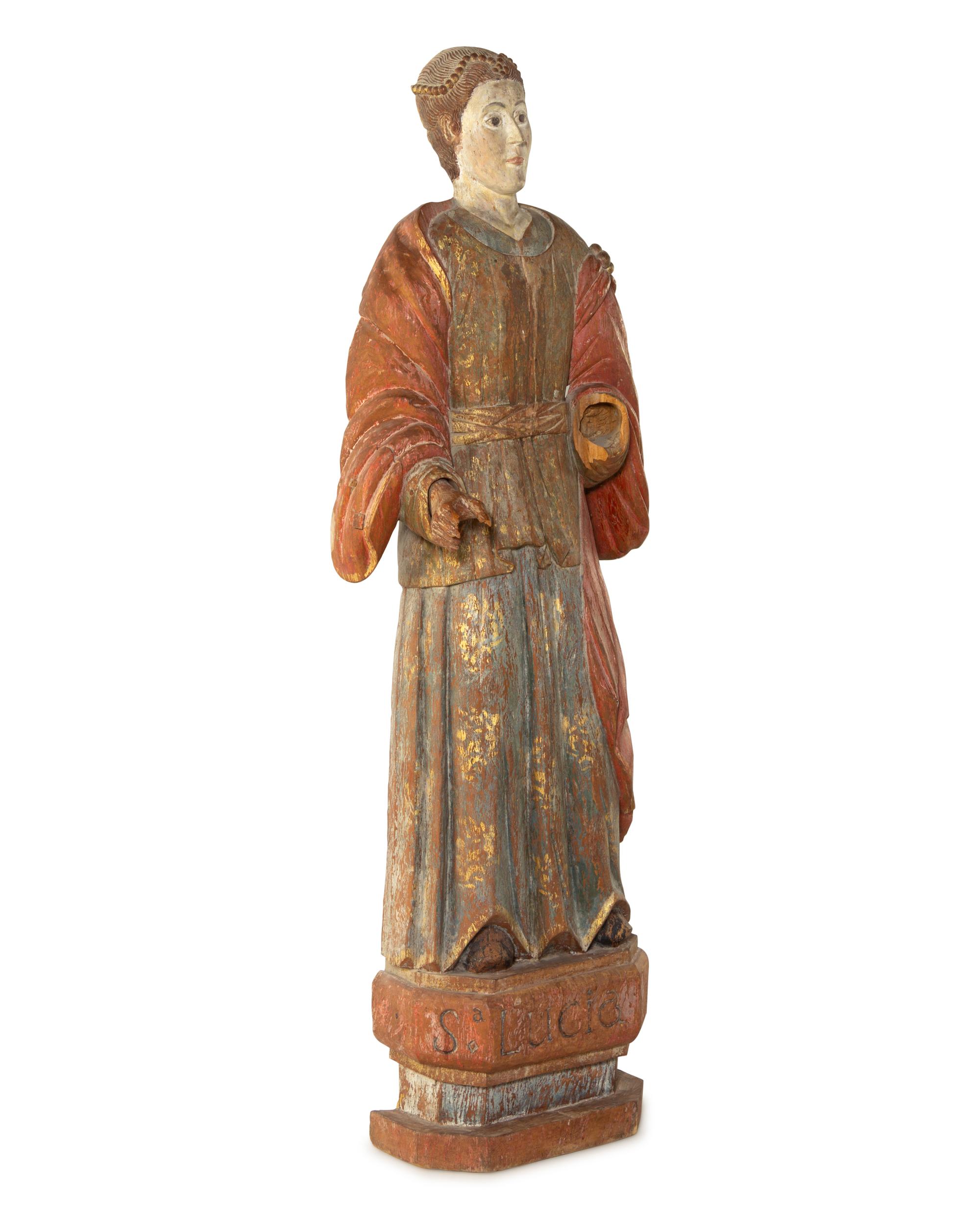 A Continental Carved and Polychromed Santo Figure