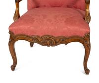 A Pair of Regence Style Carved Beechwood Fauteuils