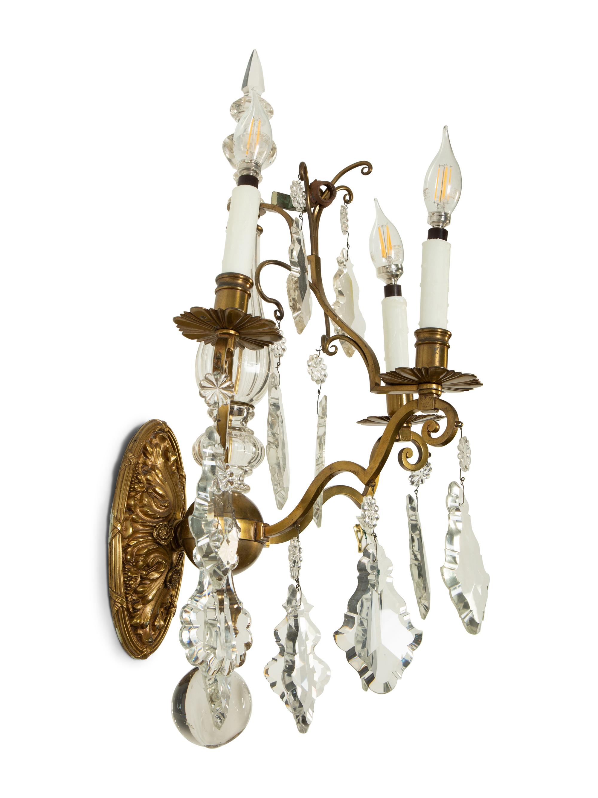 A Pair of Louis XV Style Gilt Bronze and Cut Glass Three-Light Sconces