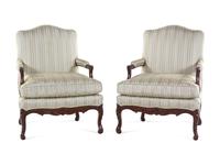 A Pair of Louis XV Style Carved Walnut Fauteuils