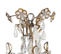 A Silvered and Gilt Metal, Cut Glass and Rock Crystal Twelve-Light Chandelier