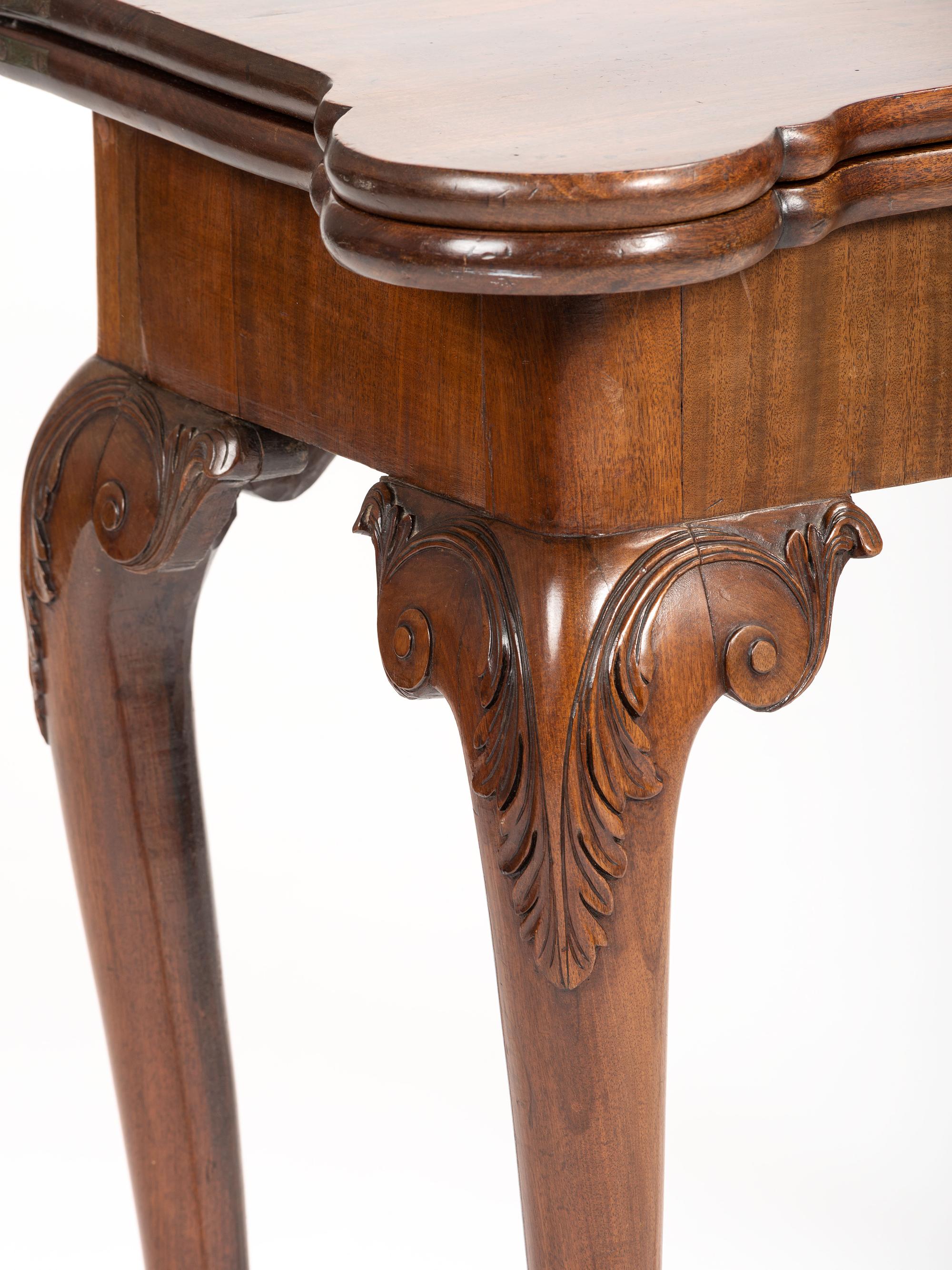A George II-Style Mahogany Concertina-Action Game Table