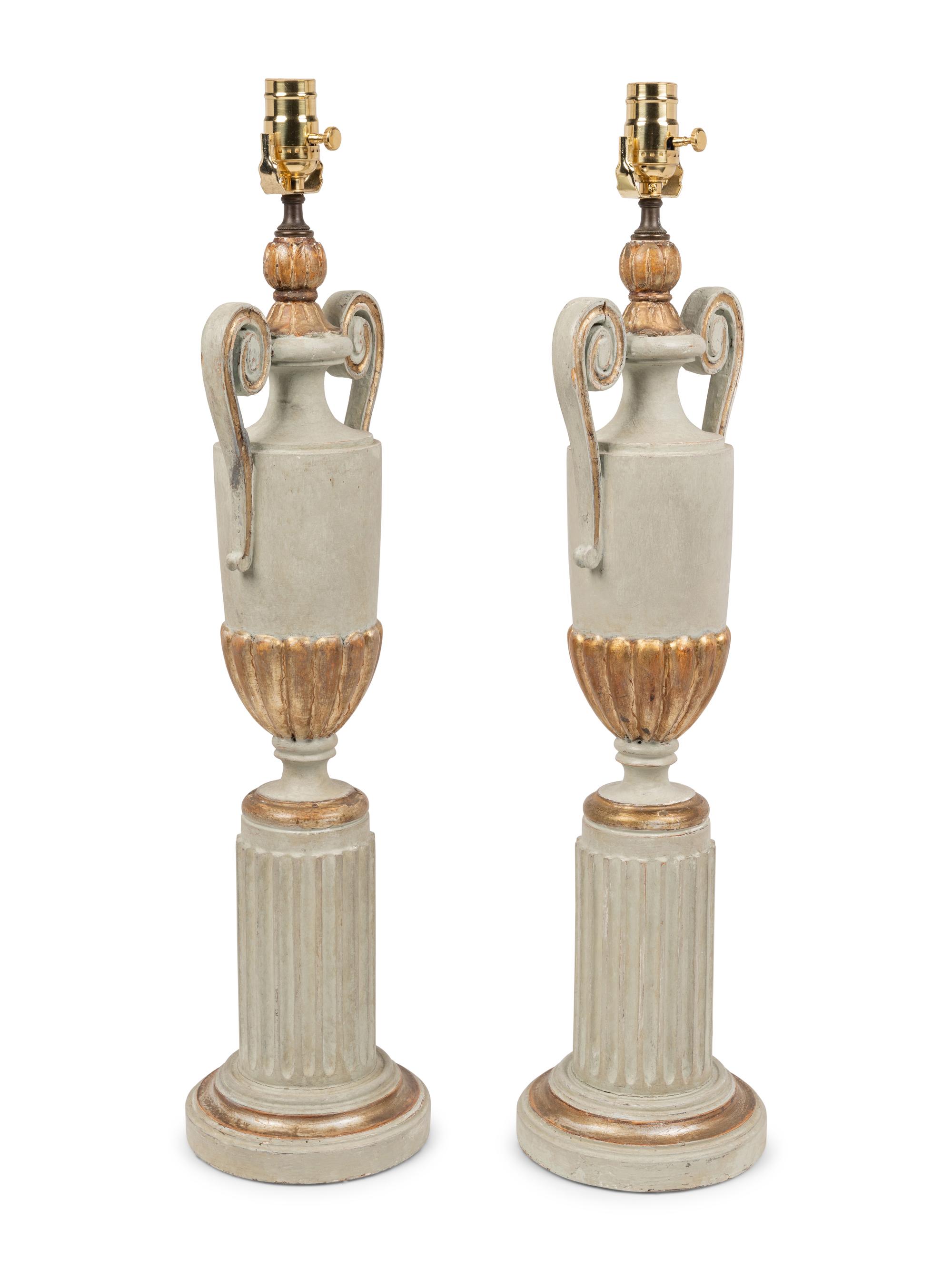 A Pair of Painted and Parcel Gilt Urns on Plinths Mounted as Lamps