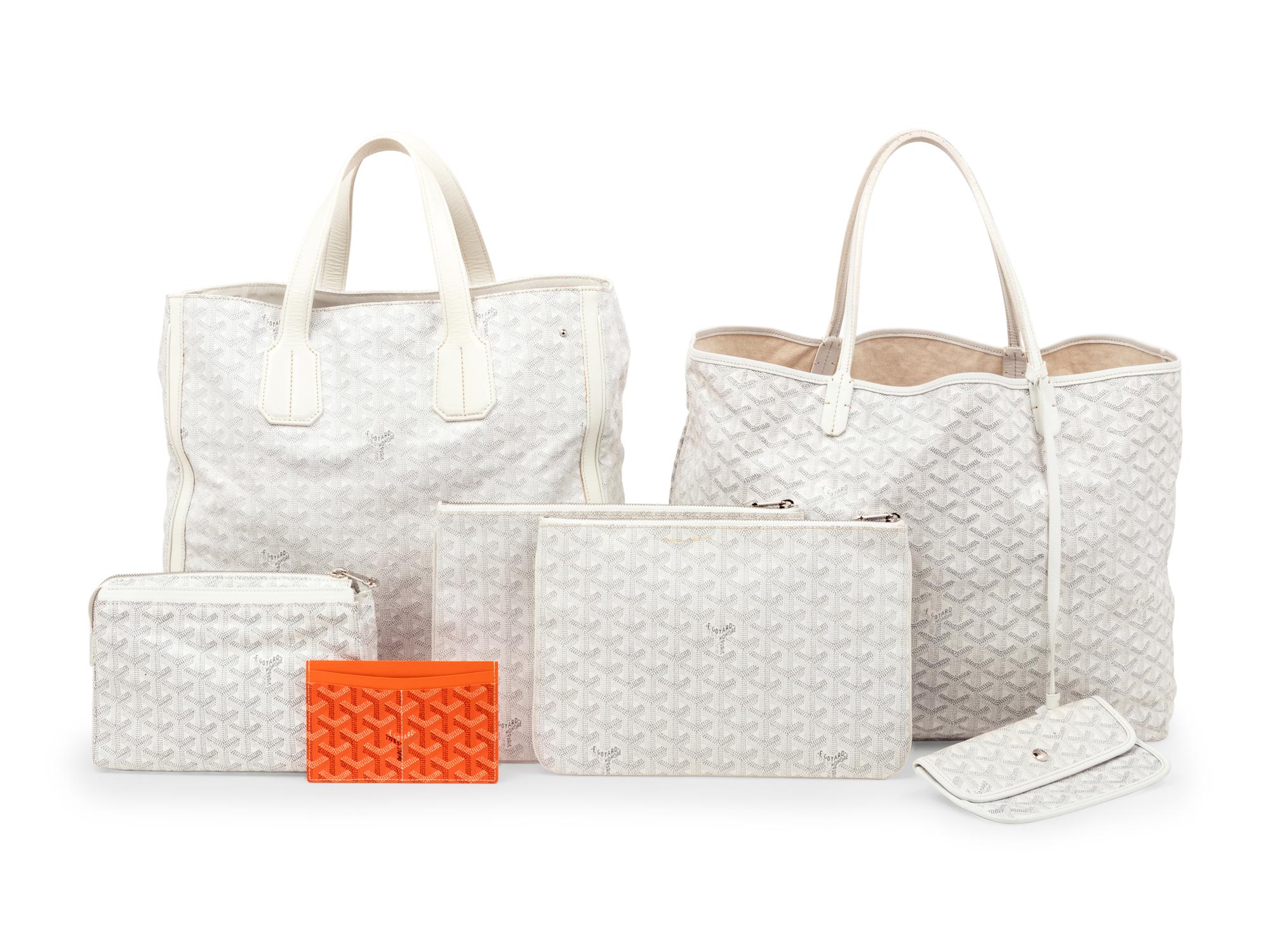Six Goyard Items: Two Totes, Three Pouches, and One Wallet