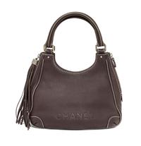 A Chanel Light Brown Caviar Leather Handbag, 12" x 8" x 5".