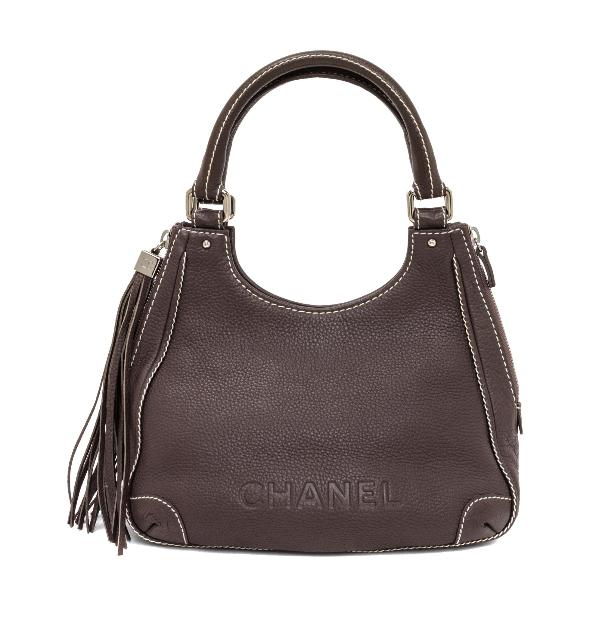 A Chanel Light Brown Caviar Leather Handbag, 12" x 8" x 5".