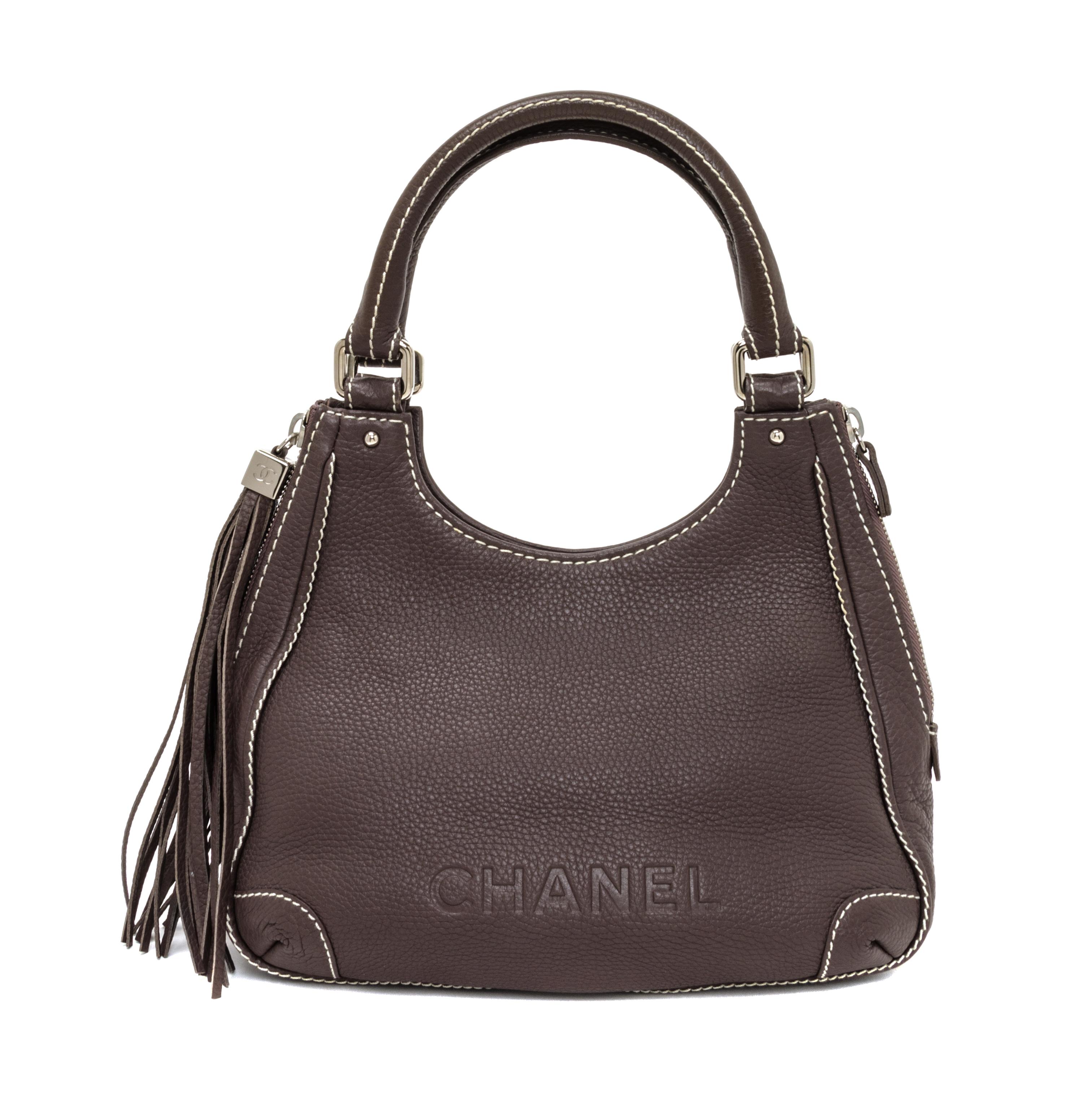 A Chanel Light Brown Caviar Leather Handbag, 12" x 8" x 5".