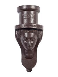 A Glazed Sewer Tile 'Liberty Head' Hanging Match Holder