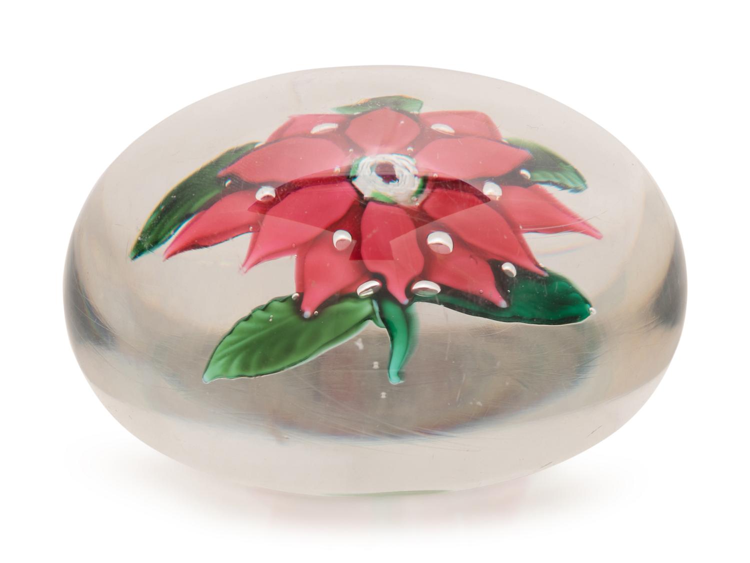 A Magenta Poinsettia Glass Paperweight