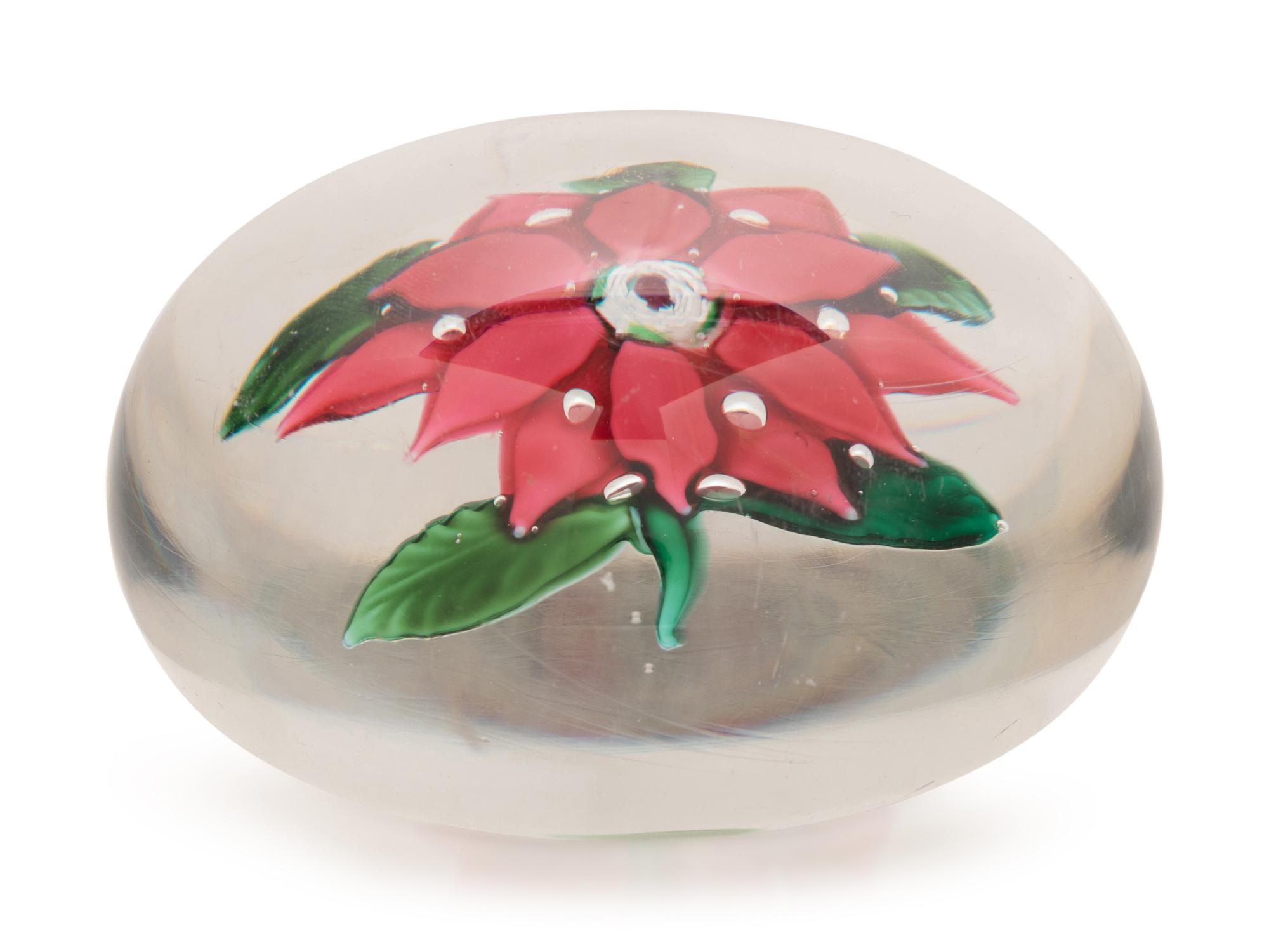 A Magenta Poinsettia Glass Paperweight