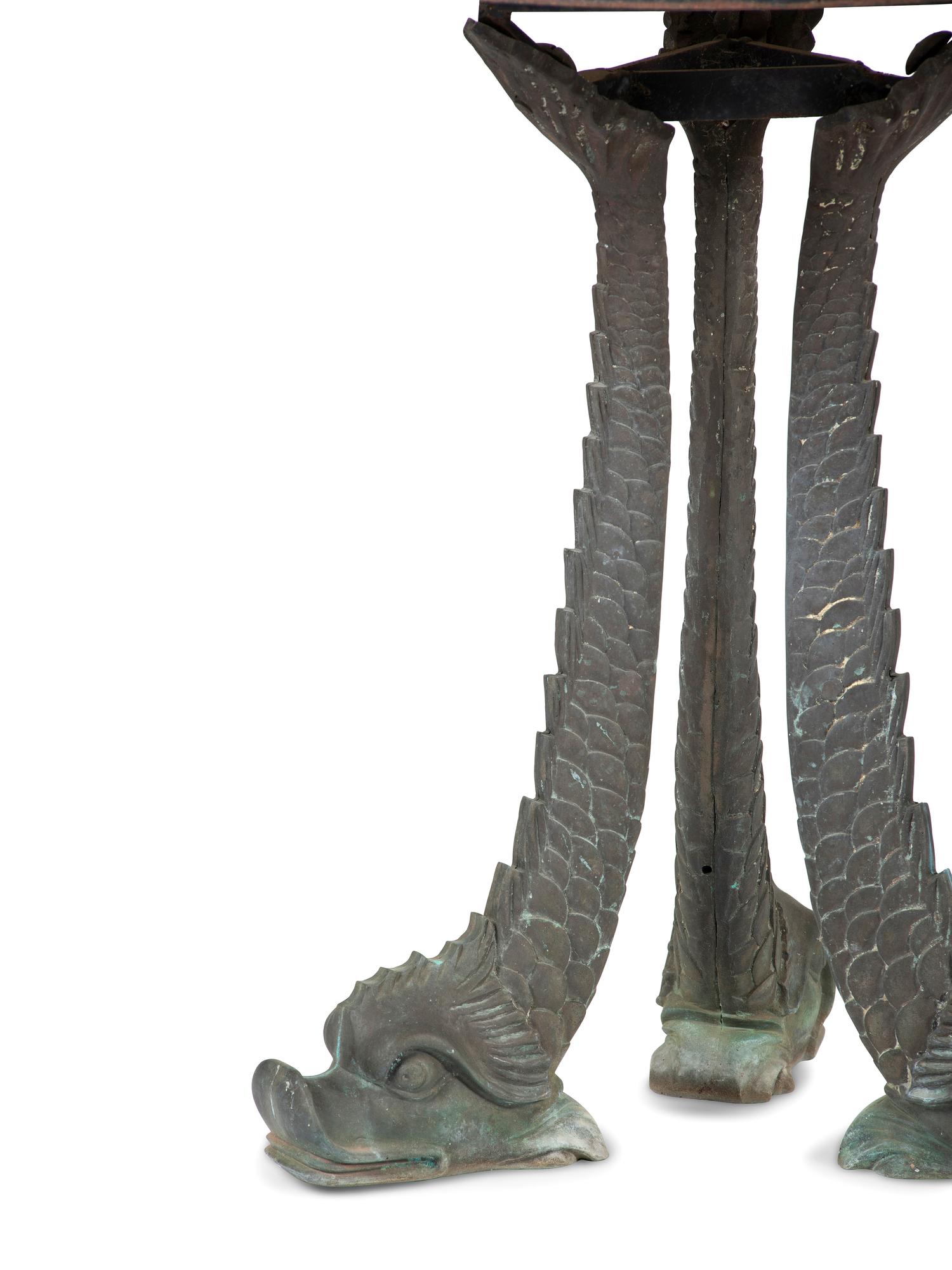 A Grotto Style Marble Inset Cast Iron and Bronze Dolphin-Base Pedestal Table
