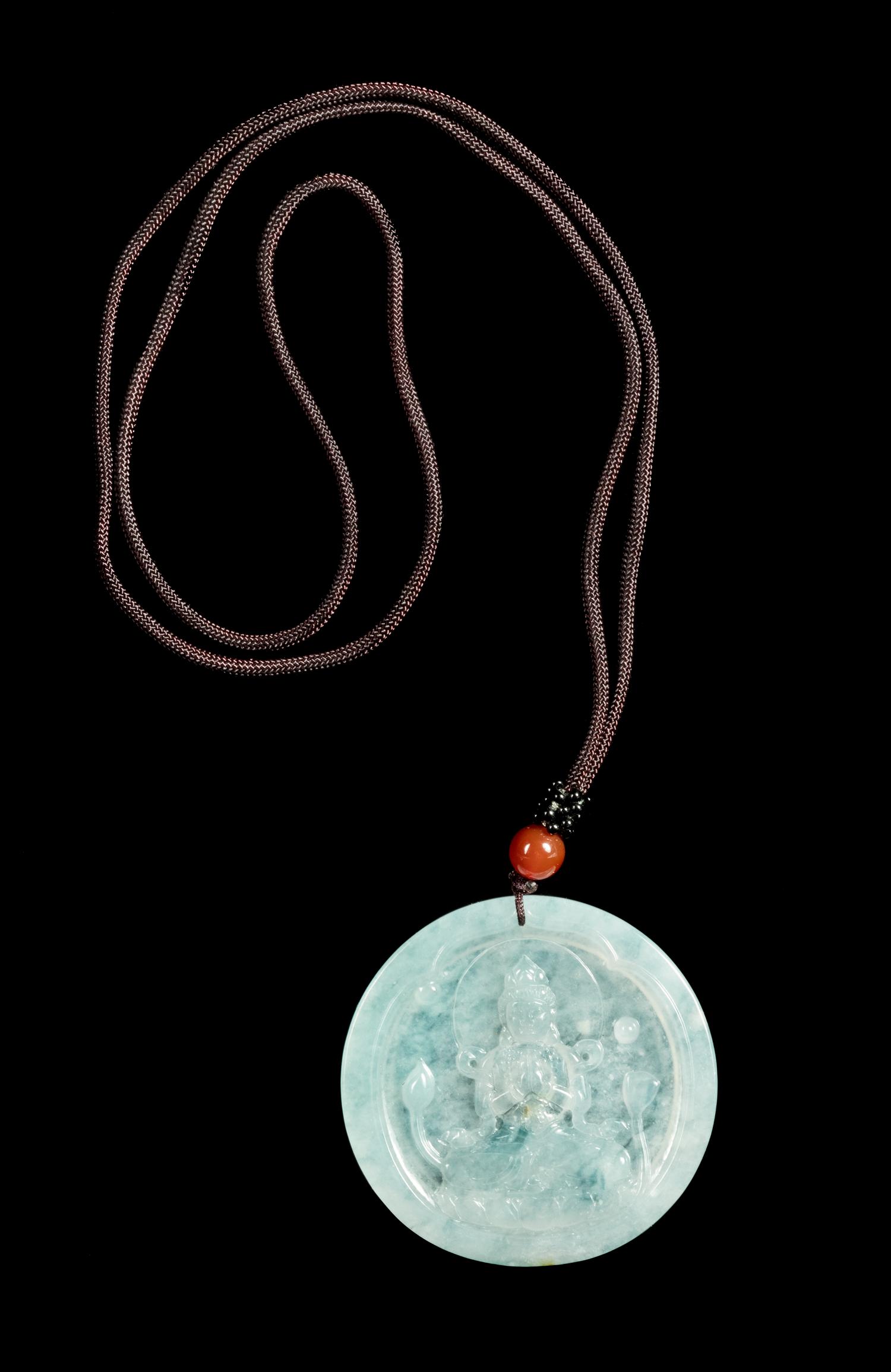 A Jadeite Pendant of Guanyin Diameter 2 1/8 inches. — 20TH CENTURY