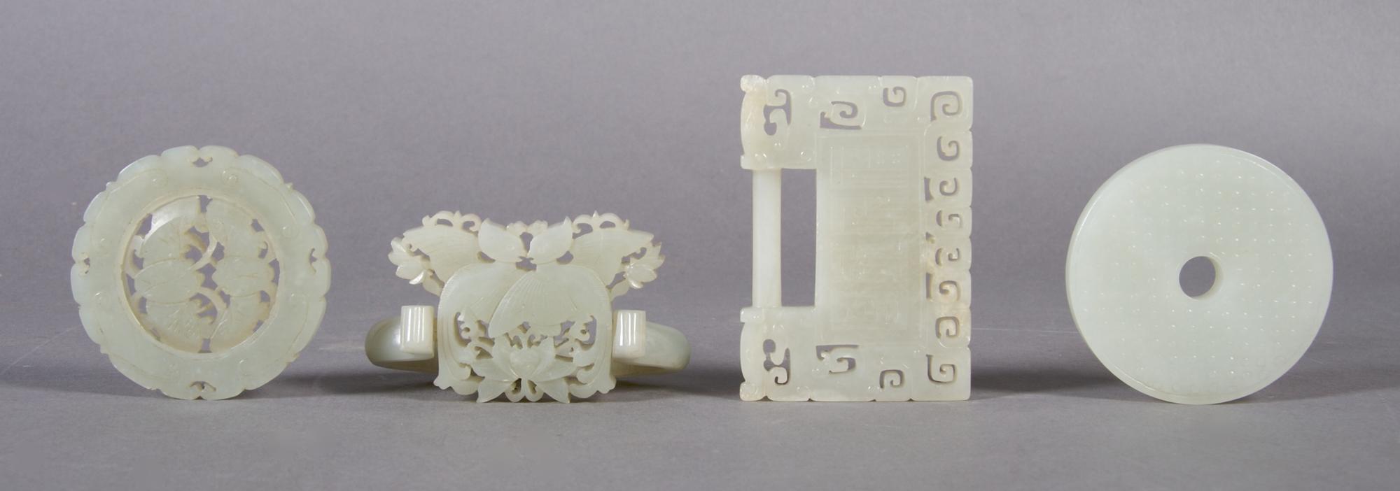 A Group of Four Chinese Jade Carved Items, Width of widest 2 3/4 inches.