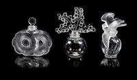 Lalique, a group of three molded and frosted glass Clairefontaine, Deux Fleurs and L'Air du Temps Fatice perfume bottles