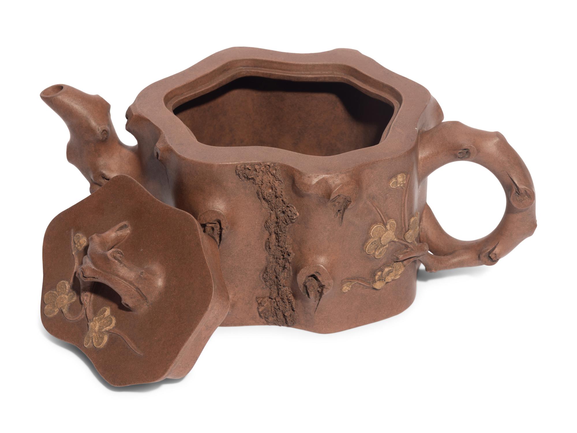 A Chinese Yixing Zisha Pottery Teapot and Four Teacups
