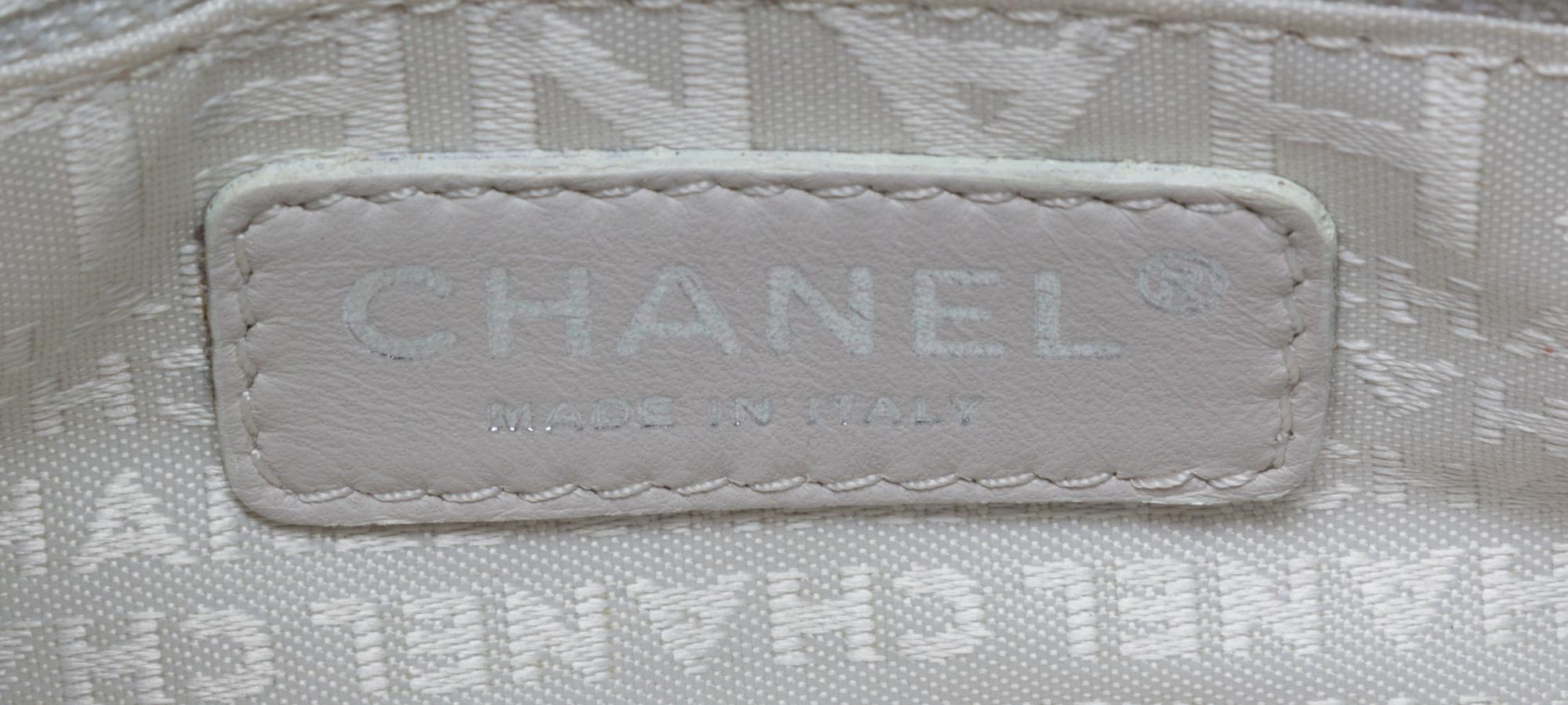 A Chanel Light Brown Caviar Leather Handbag, 12" x 8" x 5".