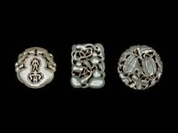 Three Chinese Pale Celadon Jade Reticulated Pendants