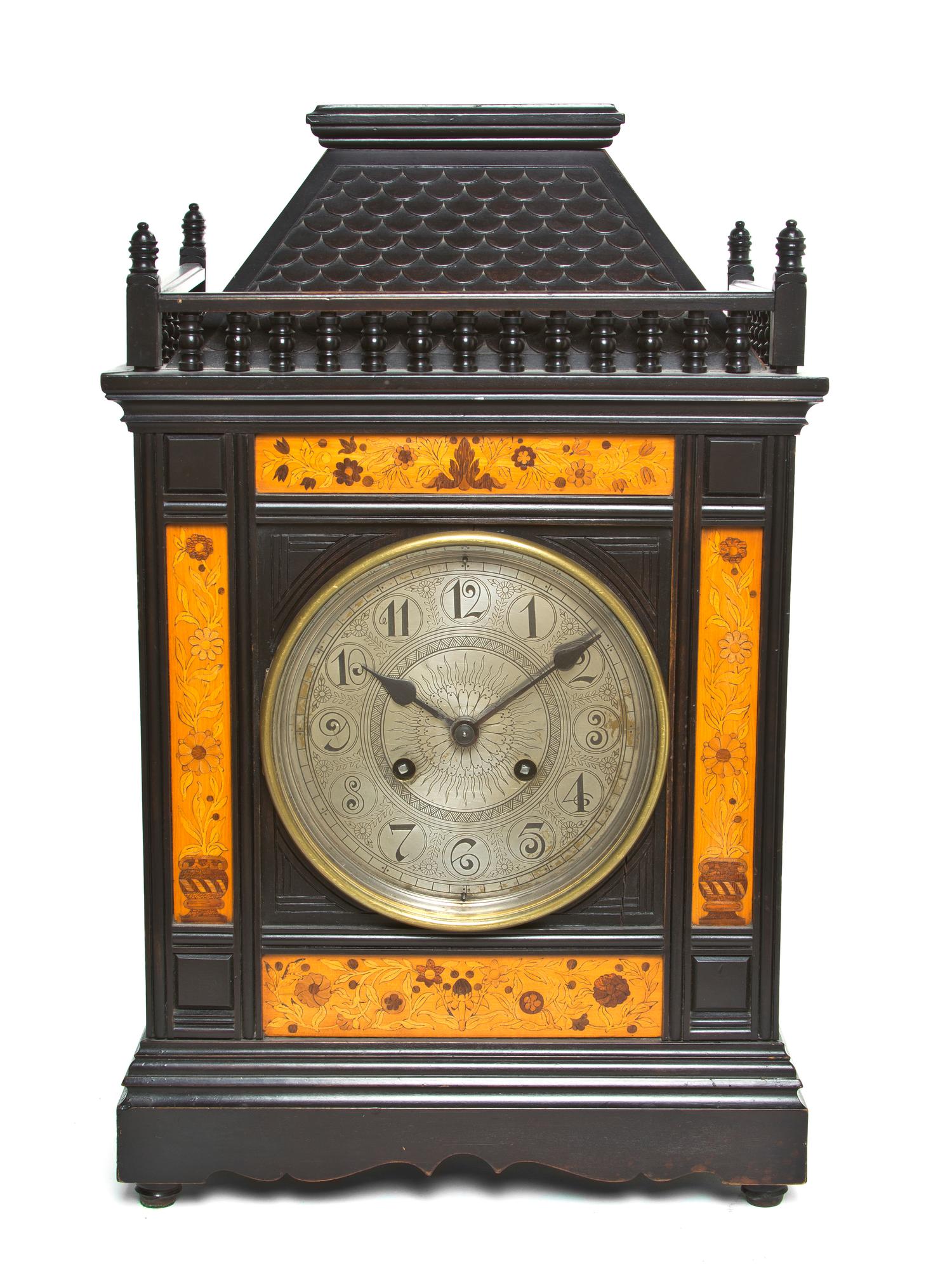 An English Aesthetic Ebonized and Marquetry Bracket Clock, Height 19 1/4 inches.