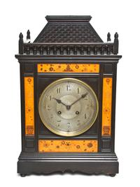 An English Aesthetic Ebonized and Marquetry Bracket Clock, Height 19 1/4 inches.