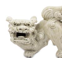 A Pair of Chinese White Glazed Porcelain Figures of Fu Lions