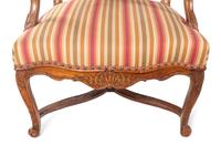 A Pair of Régence Carved Walnut Armchairs