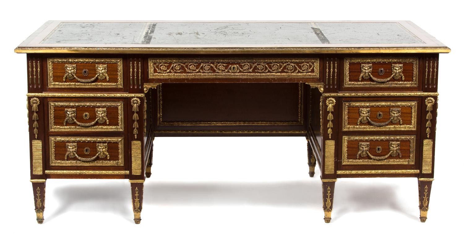 A French Empire Style Mahogany and Ormolu Writing Desk Height 31 x width 72 x depth 35 inches. — 20TH CENTURY