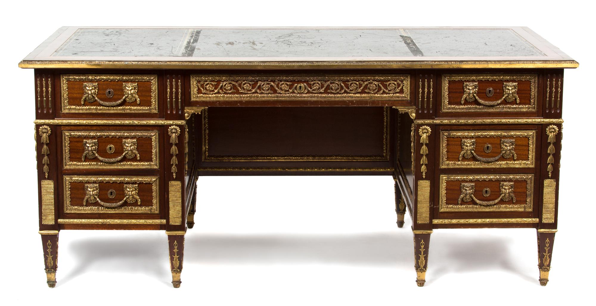 A French Empire Style Mahogany and Ormolu Writing Desk Height 31 x width 72 x depth 35 inches. — 20TH CENTURY