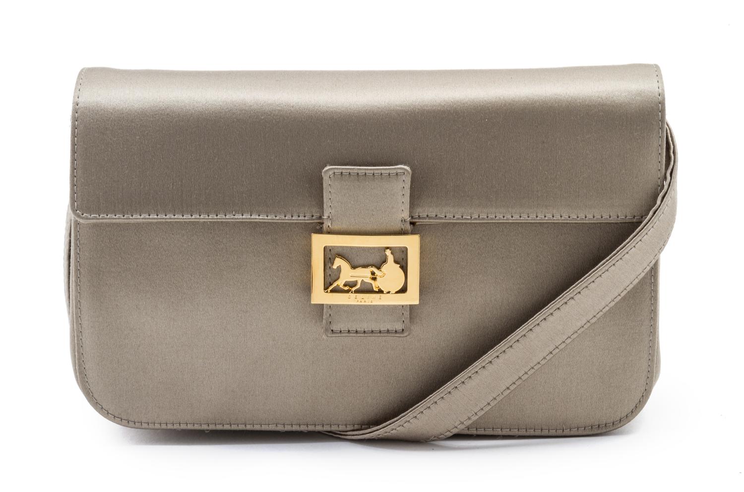 A Celine Taupe Satin Clutch, 7 1/2 x 4 x 2 inches.