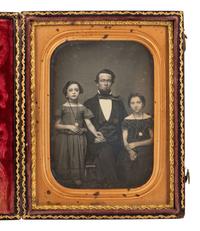[EARLY PHOT.]. 2 daguerreotypes of attractive subjects, incl. father with children & young woman.