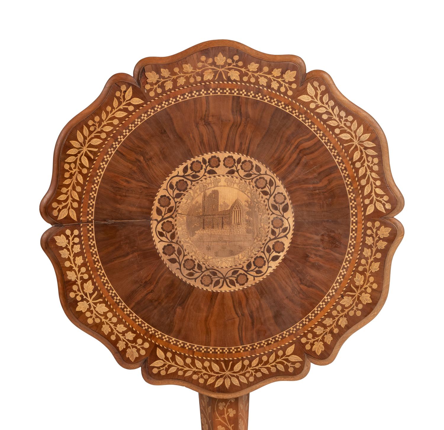 A Continental Marquetry Table on Claw Feet