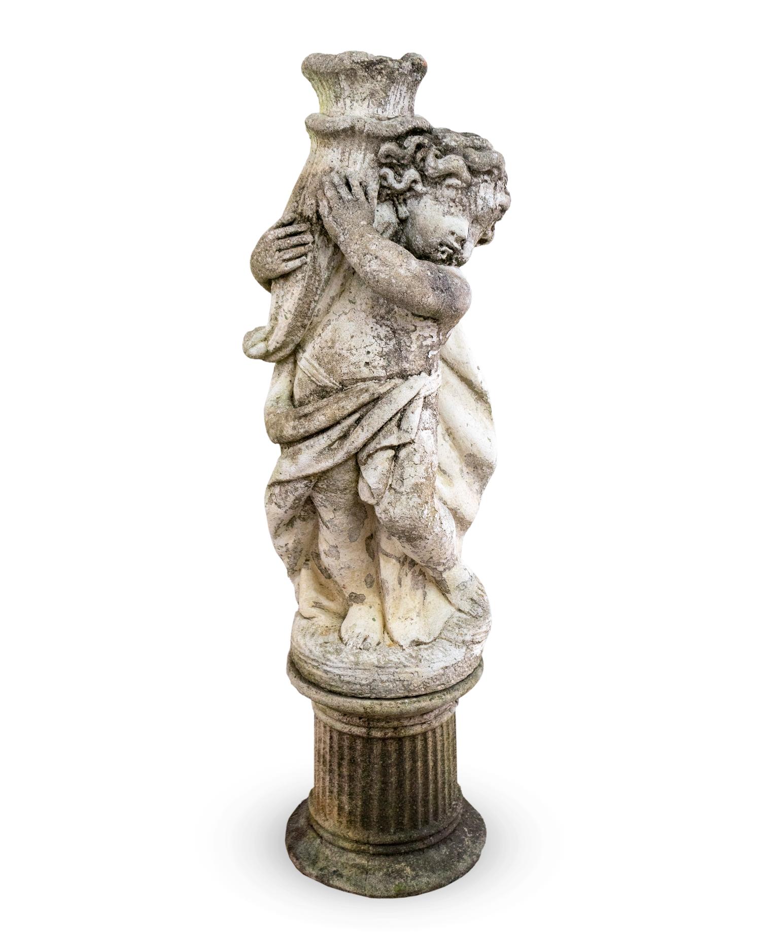 A Cast Stone Figure of a Putto Holding a Cornucopia — 20TH CENTURY
