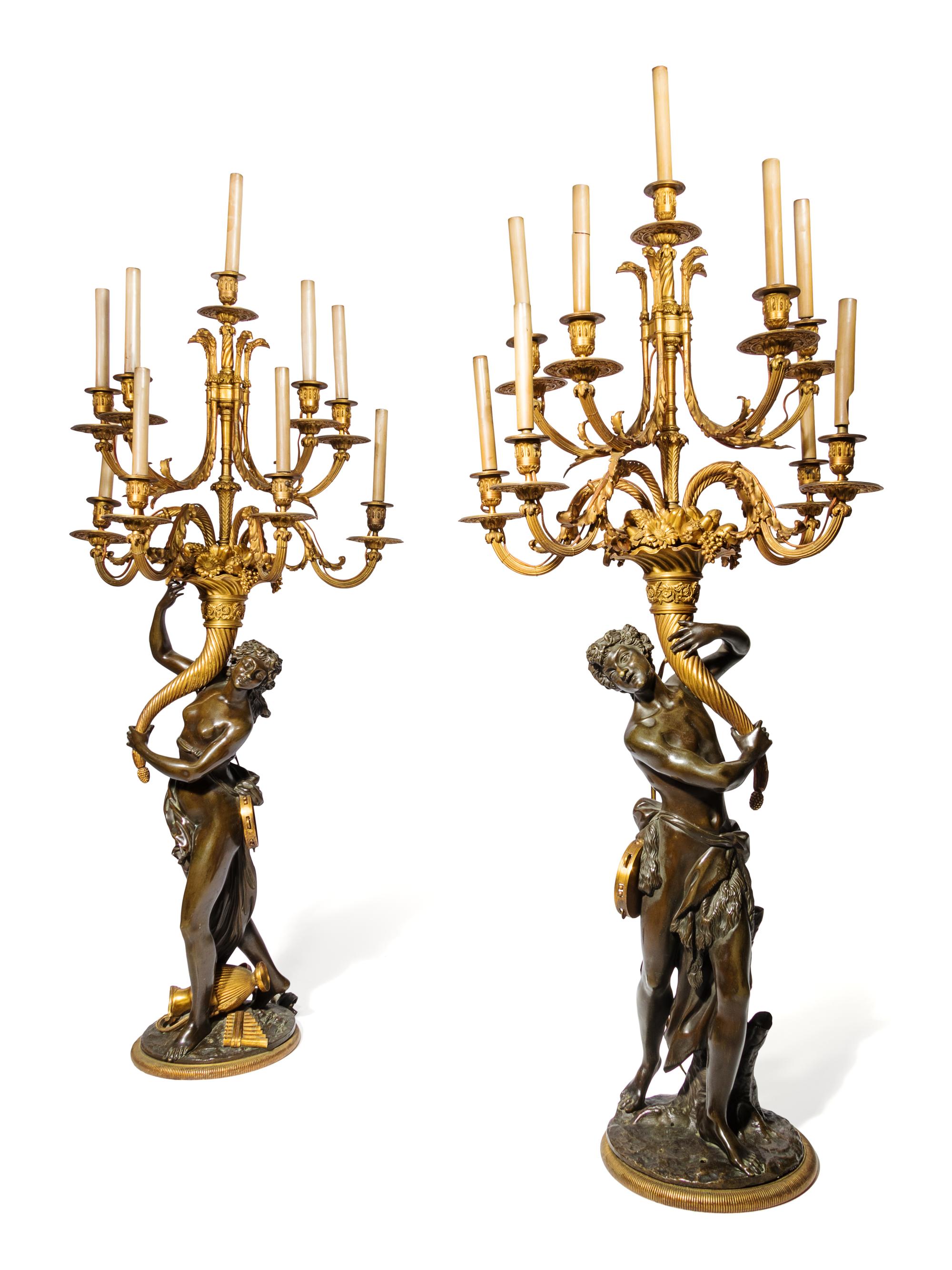 A Pair of Large Gilt and Patinated Bronze Figural Nine-Light Candelabra after the Models by Clodion