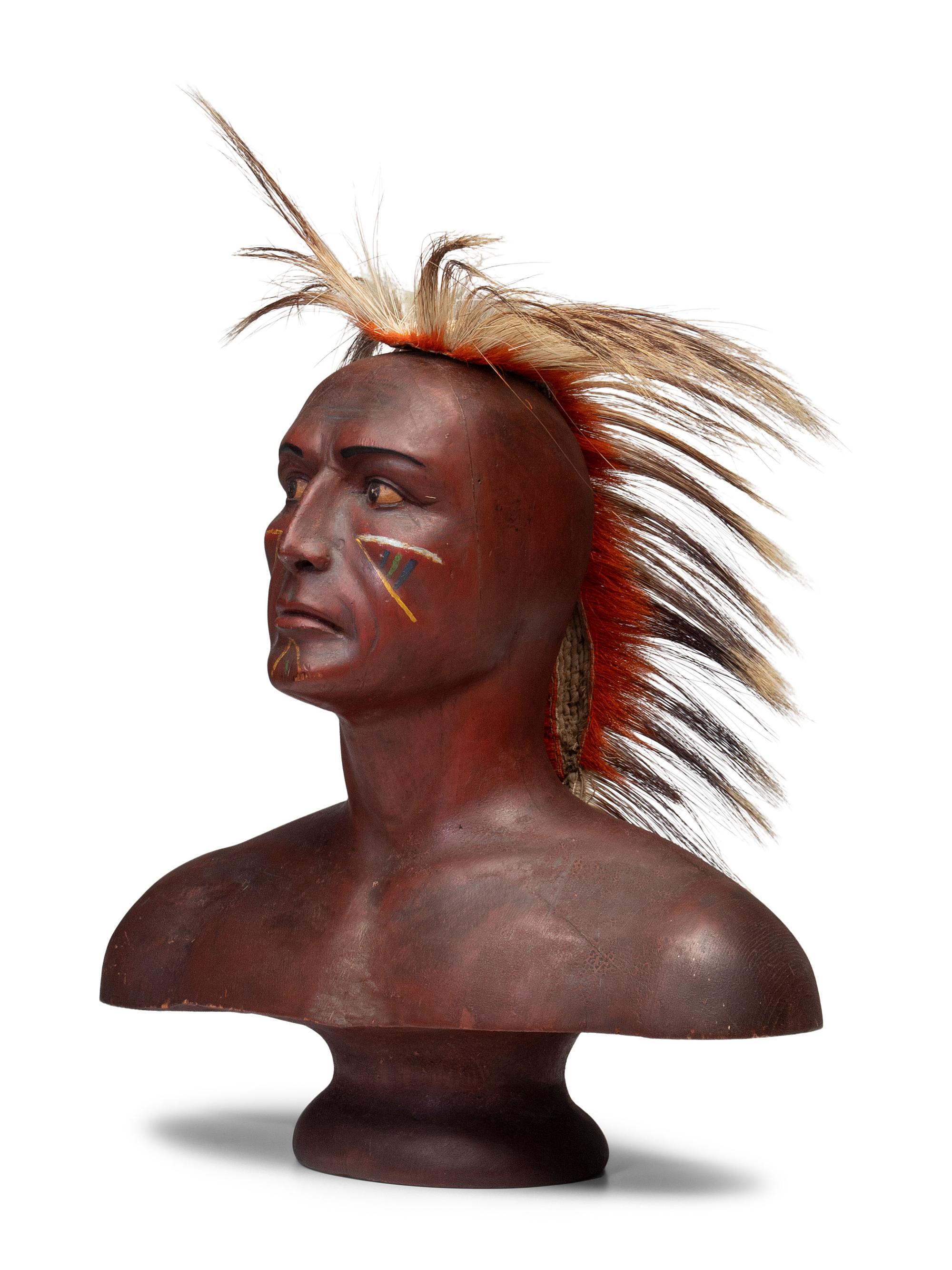 A Carved and Painted Pine Bust of a Native American