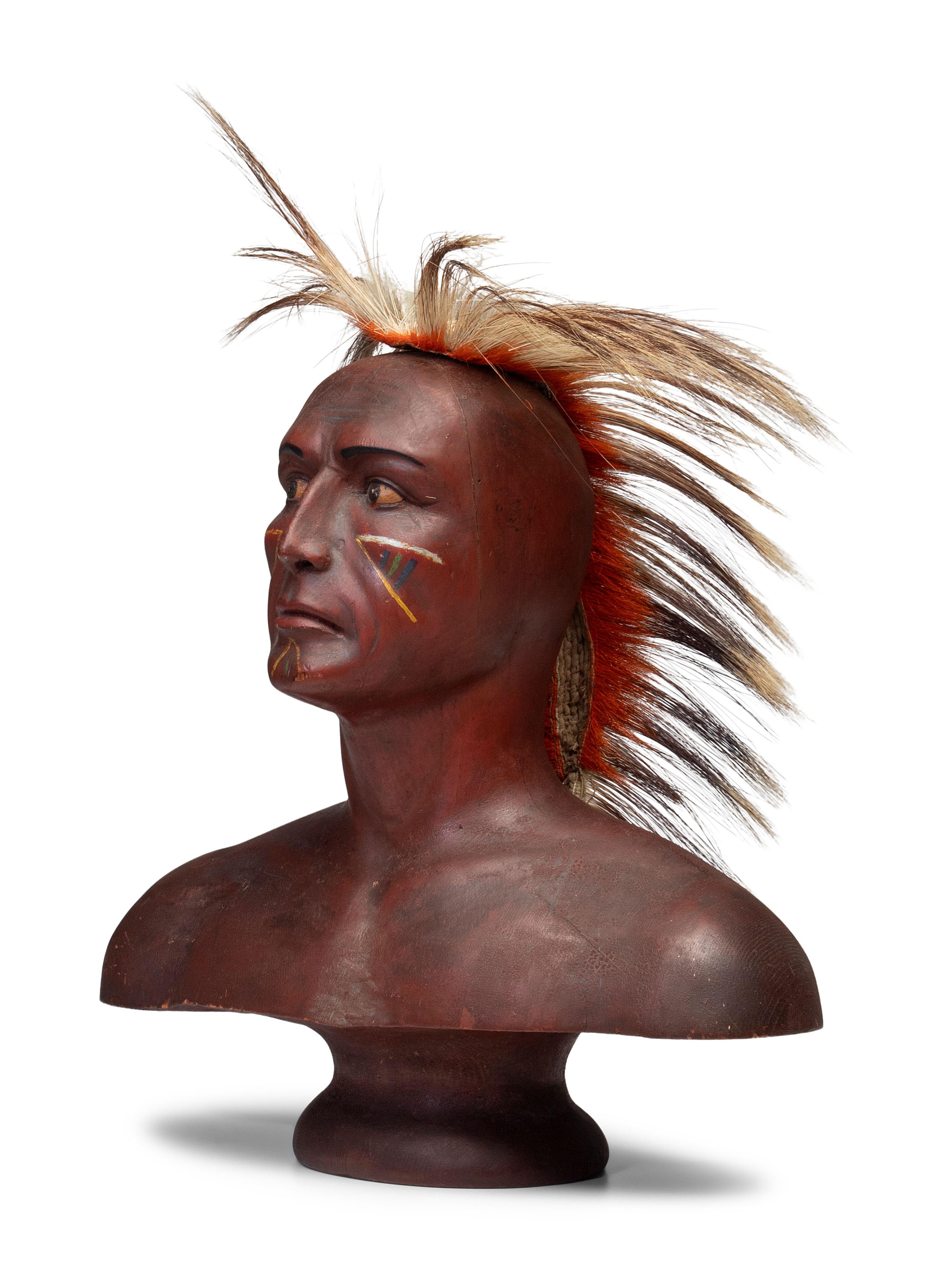 A Carved and Painted Pine Bust of a Native American