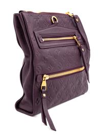 A Louis Vuitton Plum Monogram Empreinte Leather Petillante Clutch, 7" H x 10.75" W x 2.5" D.