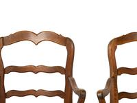 A Set of Four French Provincial Style Walnut Dining Chairs