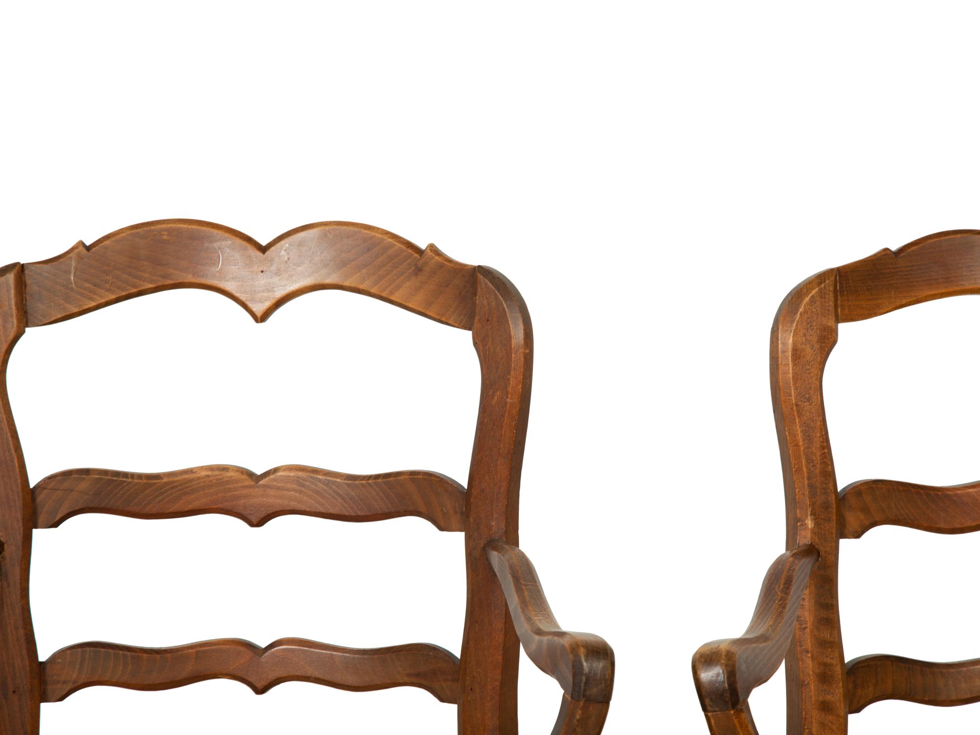 A Set of Four French Provincial Style Walnut Dining Chairs