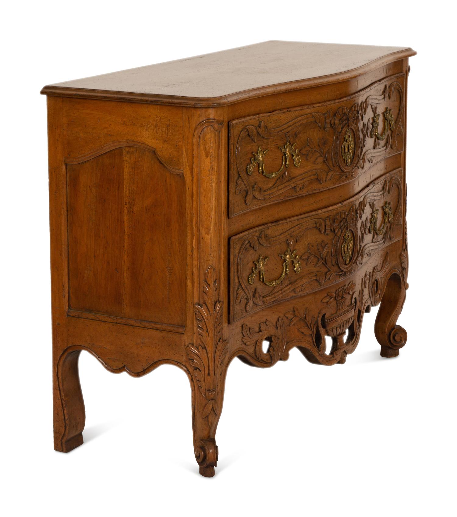 A French Provincial Carved Oak Commode