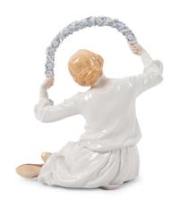 A Meissen Porcelain Figure of a Girl with Floral Wreath
