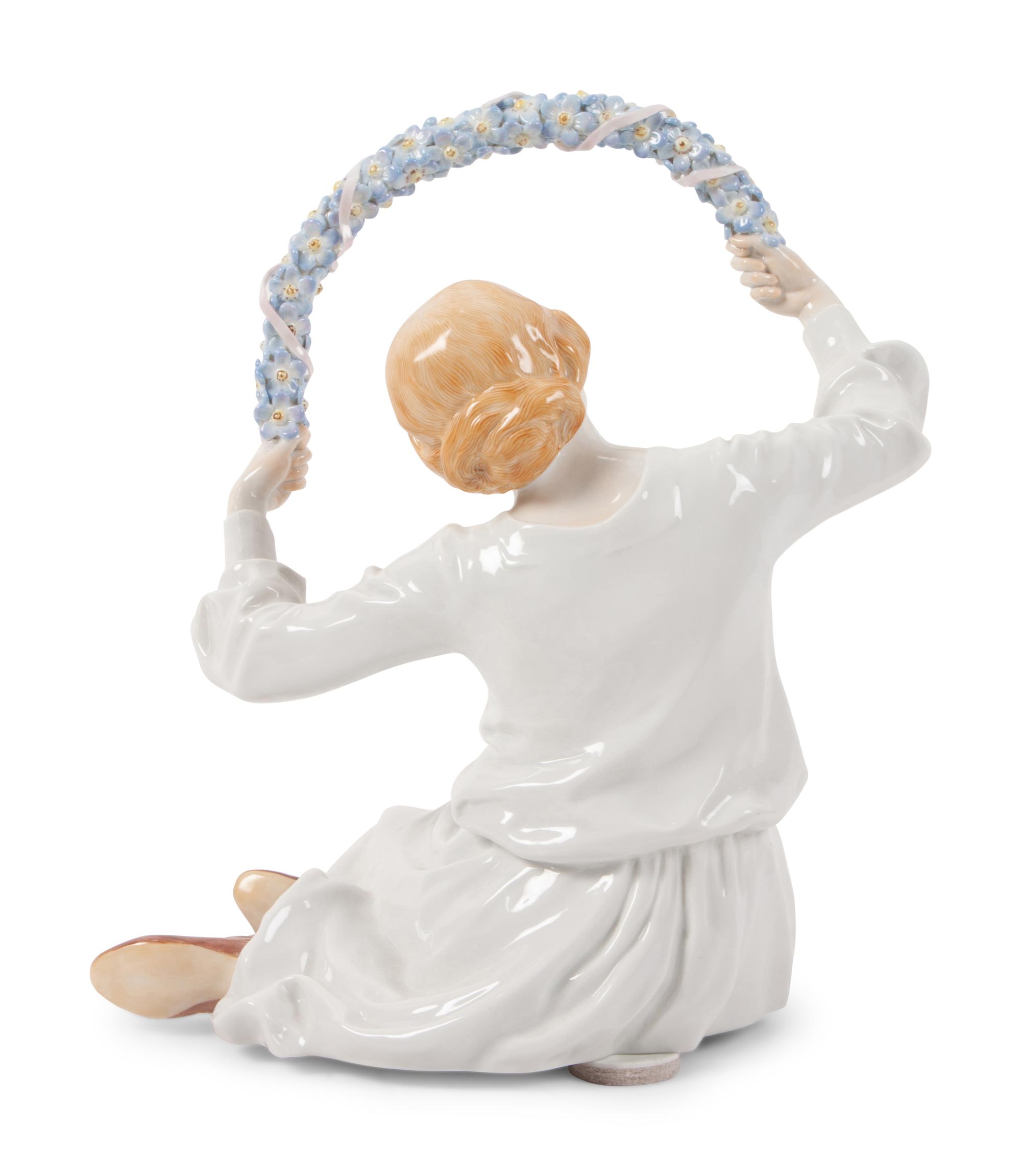 A Meissen Porcelain Figure of a Girl with Floral Wreath